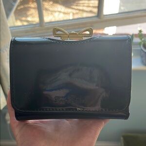 Black Leather Ted Baker Wallet with Gold Bow Accent